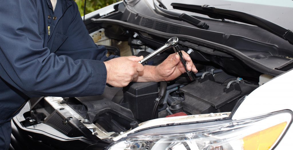 Man fixing car engine