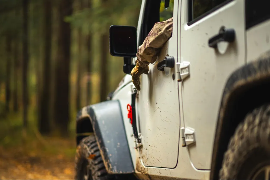 man sitting inside jeep wrangler po113 code