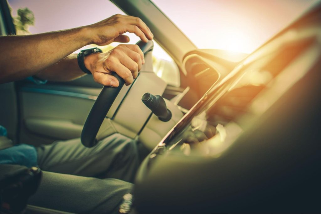 A man driving a car after reprogramming his engine control computer