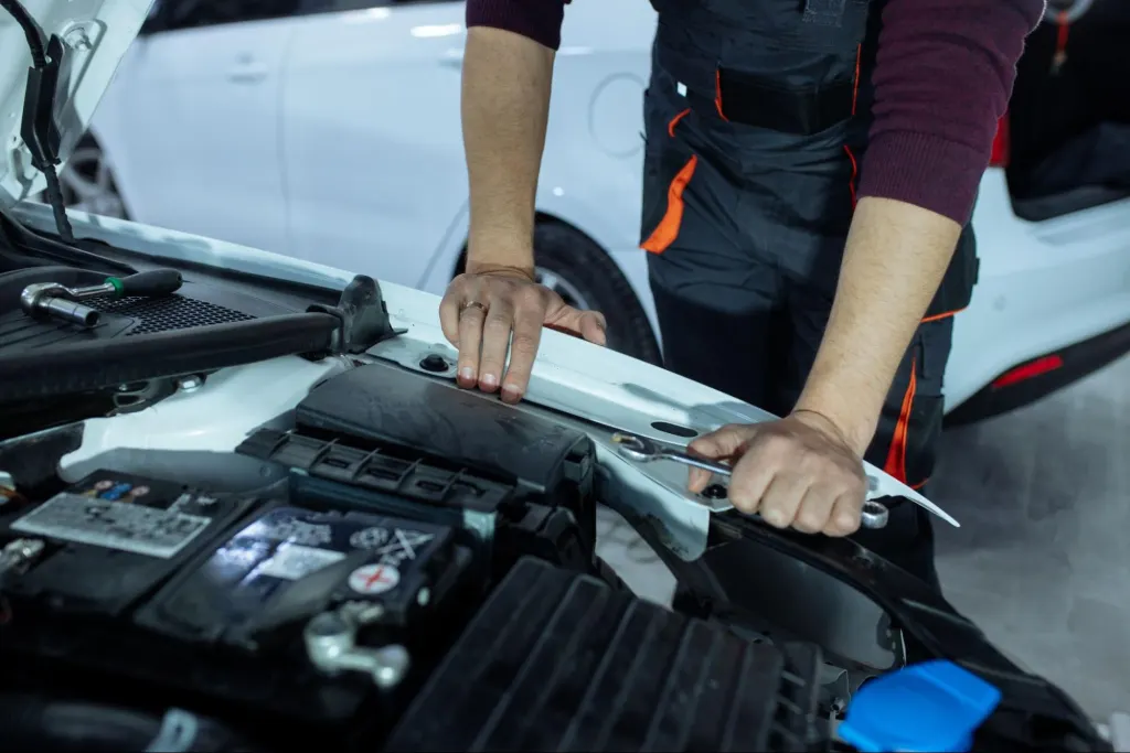 Mechanic testing vehicle engine components during ecm testing near me diagnostic session