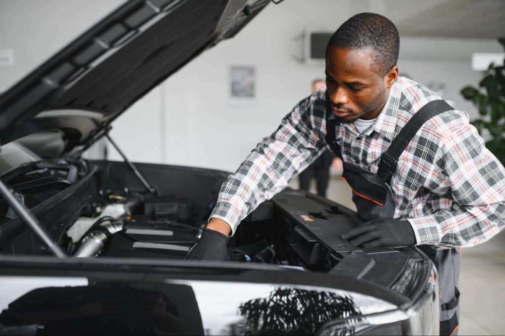 Mechanic testing a car where the OBD2 scanner is not communicating with the ECU